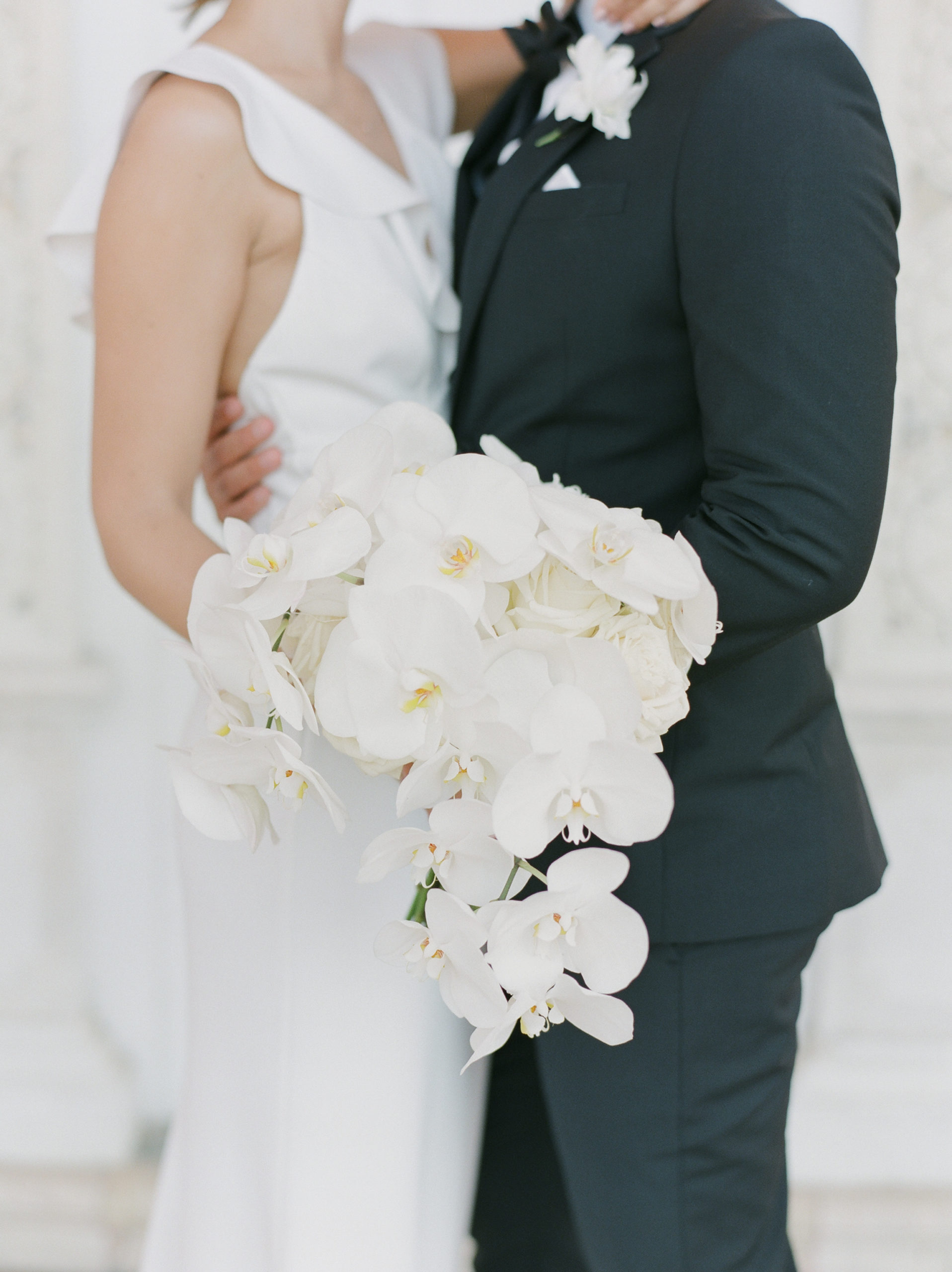 draping white orchid wedding bouquet belinda jean photography